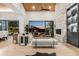 Contemporary living room featuring modern fireplace and glass sliding doors to an outdoor patio at 10800 E Cactus Rd # 38, Scottsdale, AZ 85259