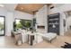 Stylish living room featuring a modern fireplace, built-in shelving, and light wood floors at 10800 E Cactus Rd # 38, Scottsdale, AZ 85259