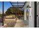 This outdoor kitchen features a built-in grill and counter space with a view of the outdoor seating area at 10800 E Cactus Rd # 38, Scottsdale, AZ 85259