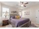 Comfortable bedroom showcasing a ceiling fan, shuttered windows, and calming neutral decor at 10960 E Monte Ave # 242, Mesa, AZ 85209