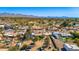 Wide aerial shot capturing a desert neighborhood with mountain views at 11616 N Miller Rd, Scottsdale, AZ 85260