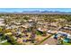 Aerial view of a desert neighborhood with mountain views at 11616 N Miller Rd, Scottsdale, AZ 85260