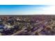 An aerial view of a residential community, showcasing lush trees and an American flag at 11627 E Bella Vista Dr, Scottsdale, AZ 85259