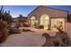 Lovely home's backyard with desert landscaping, including a rock water feature at 11627 E Bella Vista Dr, Scottsdale, AZ 85259