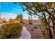 Desert landscaped backyard featuring a winding walkway, various cacti, and serene desert views at 11627 E Bella Vista Dr, Scottsdale, AZ 85259