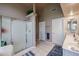 Bathroom featuring a shower, double vanity, and tile floor at 12439 W Monte Vista Rd, Avondale, AZ 85392