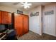 Bedroom/office with built-in cabinets, desk, and murphy bed at 12439 W Monte Vista Rd, Avondale, AZ 85392