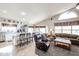 Open floor plan showcasing the living room with high ceilings and seamless access to the modern kitchen at 12439 W Monte Vista Rd, Avondale, AZ 85392