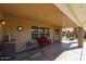 Covered patio with a wet bar, seating, and BBQ perfect for outdoor entertaining at 12439 W Monte Vista Rd, Avondale, AZ 85392