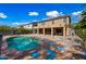 Backyard features a beautiful pool and covered patio perfect for entertaining at 13569 W Ventura St, Surprise, AZ 85379