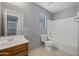 Bathroom featuring a single sink vanity, neutral walls and flooring, with a toilet and shower/tub combo at 13569 W Ventura St, Surprise, AZ 85379