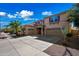 Stylish two-story home with a wide driveway, two-car garage, and a welcoming front porch at 13569 W Ventura St, Surprise, AZ 85379