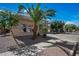 Charming home featuring desert landscaping in the front yard with sidewalk access at 13569 W Ventura St, Surprise, AZ 85379