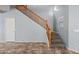 Carpeted stairway with a wooden handrail, with neutral wall paint at 13569 W Ventura St, Surprise, AZ 85379