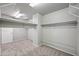 Spacious walk-in closet features neutral carpet, recessed lights, and ample wire shelving for optimal storage solutions at 13569 W Ventura St, Surprise, AZ 85379