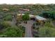 Expansive aerial view of estate nestled among desert landscape and mountain views at 1489 Thrasher Ln, Wickenburg, AZ 85390