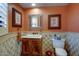 Bathroom with framed artwork, vanity with sink, and tiled walls at 1489 Thrasher Ln, Wickenburg, AZ 85390