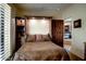 Cozy bedroom with a murphy bed, built-in shelving, and natural light at 1489 Thrasher Ln, Wickenburg, AZ 85390