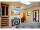 Bright bedroom features custom wood cabinet, accent table, and desert view at 1489 Thrasher Ln, Wickenburg, AZ 85390