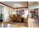 Dining room features a wooden table, elegant chairs, and an eye-catching light fixture at 1489 Thrasher Ln, Wickenburg, AZ 85390