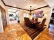 Dining room with seating for six, unique artwork, and beautiful marble flooring at 1489 Thrasher Ln, Wickenburg, AZ 85390