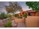 Exterior view of desert home and walkway through native landscaping at 1489 Thrasher Ln, Wickenburg, AZ 85390