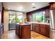 Kitchen featuring an island, stainless steel appliances, and a large window at 1489 Thrasher Ln, Wickenburg, AZ 85390