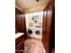 Laundry room with a washer, a dryer, and shelving for storage at 1489 Thrasher Ln, Wickenburg, AZ 85390