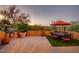 An outdoor patio with comfortable seating, an umbrella, and great views at 1489 Thrasher Ln, Wickenburg, AZ 85390