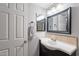 Bathroom with a vanity, mirror, and a tiled backsplash at 1601 E Elgin St, Chandler, AZ 85225