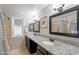 Bathroom features a double vanity with granite countertop and framed mirrors at 1601 E Elgin St, Chandler, AZ 85225