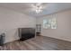 Spacious bedroom with wood-look flooring, ceiling fan and murphy bed with storage cabinet at 1601 E Elgin St, Chandler, AZ 85225