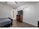 Cozy bedroom with wood flooring and a dresser with a TV at 1601 E Elgin St, Chandler, AZ 85225