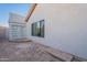 Home exterior with stucco walls, a tile roof, and a brick patio, blending classic charm and durability at 1601 E Elgin St, Chandler, AZ 85225