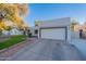 Charming home featuring a well-manicured lawn and a two-car garage with a large driveway at 1601 E Elgin St, Chandler, AZ 85225