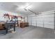 Spacious garage featuring an office space, foosball table, and a large two-car garage door at 1601 E Elgin St, Chandler, AZ 85225