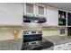 Close-up of a modern kitchen with stainless steel appliances and tile backsplash at 1601 E Elgin St, Chandler, AZ 85225