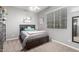 Cozy bedroom with neutral tones, soft carpet, and a sunny window at 16561 W Cielo Grande Ave, Surprise, AZ 85387