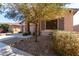 Charming single-Gathering home featuring a well-maintained front yard and stone-accented columns at 16561 W Cielo Grande Ave, Surprise, AZ 85387