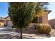 Charming front yard featuring desert landscaping, shutters, and a peek at the home's entryway at 16561 W Cielo Grande Ave, Surprise, AZ 85387