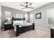 Inviting main bedroom with a ceiling fan, neutral paint, and plush carpeting at 16561 W Cielo Grande Ave, Surprise, AZ 85387