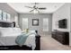 Spacious main bedroom showcasing neutral tones, carpet flooring, and a ceiling fan at 16561 W Cielo Grande Ave, Surprise, AZ 85387