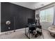 Bedroom with dark accent wall, carpeted floors, and great natural light at 16846 W Molly Ln, Surprise, AZ 85387