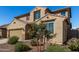 Charming two-story home with a well-maintained front yard and a two car garage at 16846 W Molly Ln, Surprise, AZ 85387