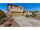 Charming two-story home with a well-maintained front yard and a two car garage at 16846 W Molly Ln, Surprise, AZ 85387