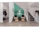 Bright hallway featuring tile floors, natural light, and seating at 16846 W Molly Ln, Surprise, AZ 85387