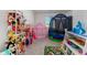 ' playroom with toys, a tent, shelves, and a trampoline at 16846 W Molly Ln, Surprise, AZ 85387