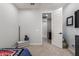 Bedroom featuring carpeted floors, a blue teddy bear and an open doorway at 17762 W Granite View Dr, Goodyear, AZ 85338