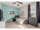 Bedroom featuring stylish décor, ceiling fan, with carpeted floors and natural light at 17762 W Granite View Dr, Goodyear, AZ 85338