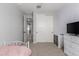 Bright bedroom with a large closet, textured accent wall and neutral color scheme at 17762 W Granite View Dr, Goodyear, AZ 85338